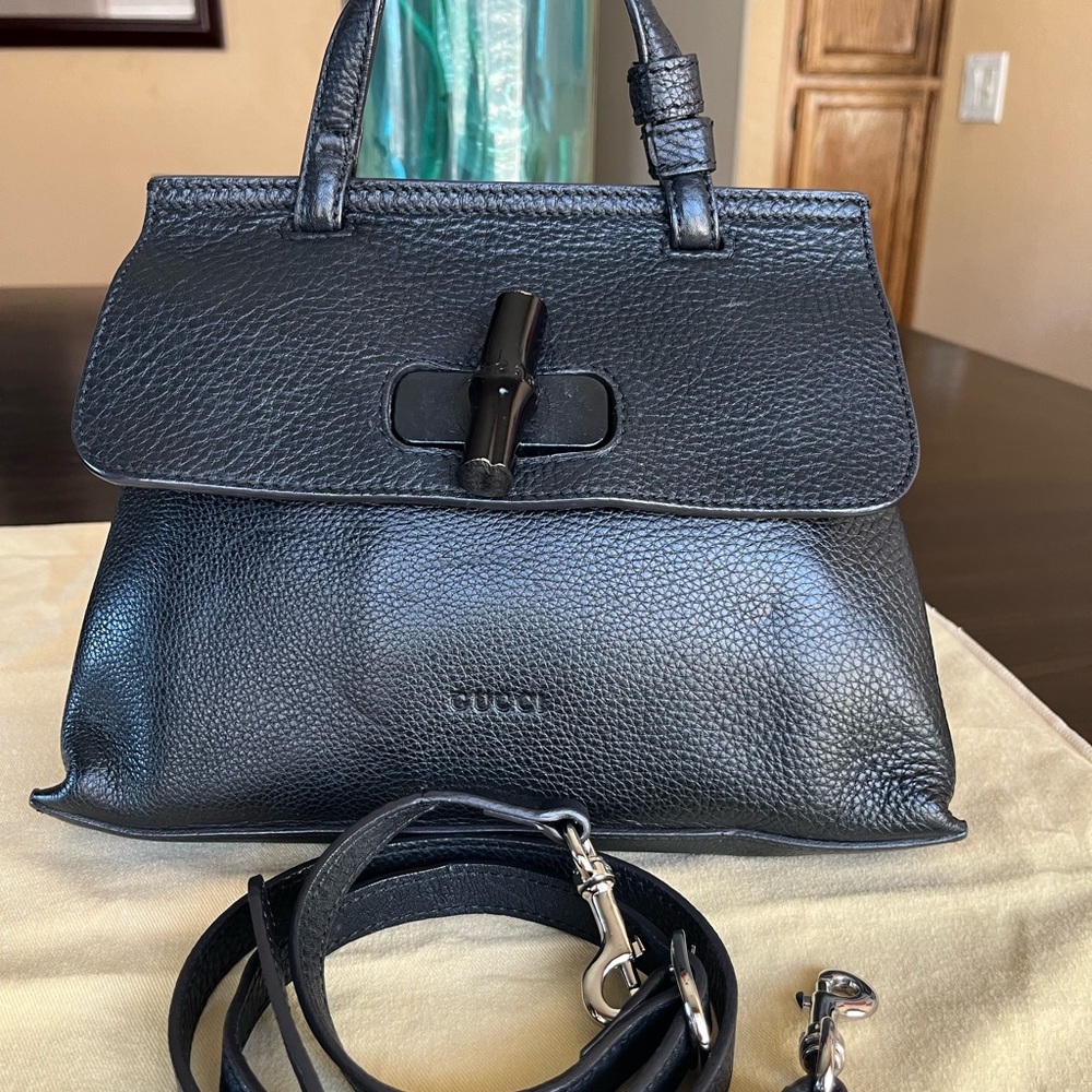 Gucci vintage bamboo Black Leather turn lock top handle bag with sling strap.
